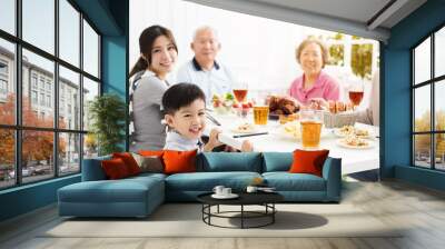 happy asian family having dinner at home Wall mural